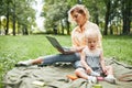 Mother Working Online in Park Royalty Free Stock Photo