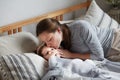 Mother worried son health check hot forehead lying on bed pillow. Preschooler feeling head pain ache Royalty Free Stock Photo