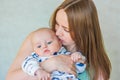 mother& x27;s kiss. the baby is cute Royalty Free Stock Photo