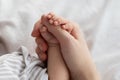 Mother& x27;s Protection. Closeup Of Unrecognizable Mom Holding Tiny Hand Of Newborn Baby Royalty Free Stock Photo