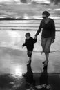 Mother Young Child on Beach holding hands Royalty Free Stock Photo