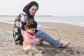 Mother and young child with diaper at beach care and watchfulness concept