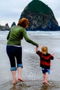 Mother and Young Child Reflection on Beach Vertical Royalty Free Stock Photo