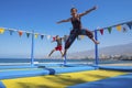 Mother and young child son caucasian playing and jumping like crazy having a lot of fun in vacation. outdoor leisure activity for