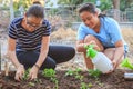 mother and young daughter planting vegetable in home garden field use for people family and single mom relax outdoor activities