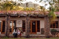 A mother and young son sitting on their porch in front of their new home. Royalty Free Stock Photo