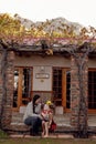 A mother and young son sitting on their porch in front of their new home. Royalty Free Stock Photo