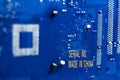 . motherboard. color blue. there are scratches on it. Caption Made in China Royalty Free Stock Photo