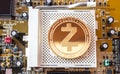 Crypto currency gold coin zcash on a motherboard
