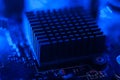 Motherboard radiator with blue backlight. Electronics in neon light Royalty Free Stock Photo