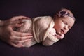 Mothercare newborn concept. Mother holding baby feet and heart Royalty Free Stock Photo