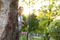 Motherhood, care, infants, summer, parenting concept - Young beautiful mom with a newborn baby in a sling walks and Royalty Free Stock Photo