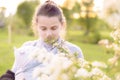 Motherhood, care, infants, summer, parenting concept - Young beautiful mom with a newborn baby in a sling walks and Royalty Free Stock Photo