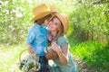 Motherhood concept. Happy summer family at park. Mother and child at spring picnic. Outdoor leisure.