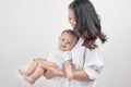 Motherhood and lifestyle concept. Smiling young mother with little baby at home Royalty Free Stock Photo