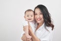 Motherhood and lifestyle concept. Smiling young mother with little baby at home Royalty Free Stock Photo