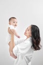 Motherhood and lifestyle concept. Smiling young mother with little baby at home Royalty Free Stock Photo