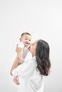 Motherhood and lifestyle concept. Smiling young mother with little baby at home Royalty Free Stock Photo