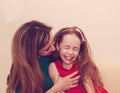 Motherhood is pure joy. Beautiful young woman hugging little girl, smiling and looking at her with love. Mother and daughter Royalty Free Stock Photo