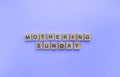 Mothering Sunday, Mothers Day, a minimalistic banner with an inscription in wooden letters