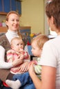 Mothers With Babies Chatting At Playgroup