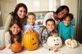 Mothers And Children Making Halloween Lanterns