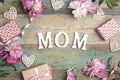 Mothers day background with pink peonies, gifts and hearts on an old turquoise boards with shabby paint Royalty Free Stock Photo