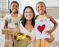 Mothers day, birthday and happy family children with gift, celebration flowers and heart card to celebrate mama. Love Royalty Free Stock Photo