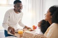 Mothers day, breakfast and family in bed with happy dad, mom and child together in home with love, care and brunch tray Royalty Free Stock Photo