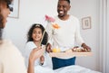 Mothers day, breakfast and mom in bed with happy family with dad and child together in home with love, care and brunch Royalty Free Stock Photo