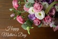 Mothers day card. Bouquet of pink roses in basket on wooden background closeup Royalty Free Stock Photo