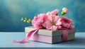 Mothers Day card or Womens Day card with bouquet of pink flowers in gift box on blue background Royalty Free Stock Photo