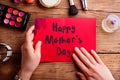 Mothers day composition. Greeting card and make up products. Royalty Free Stock Photo