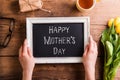 Mothers day composition. Picture frame with sign, studio shot. Royalty Free Stock Photo