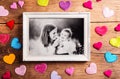 Mothers day composition, picture frame. Studio shot, wooden, background