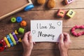 Mothers day composition, various toys. Studio shot, wooden, back Royalty Free Stock Photo