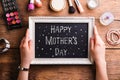 Mothers day composition. Woman with picture frame. Studio shot. Royalty Free Stock Photo