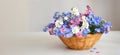 Mothers Day flowers. Forget me not flowers in the basket Royalty Free Stock Photo