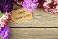 Mothers Day gift tag with flower corner border on wood