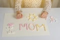 Mothers Day. gift to the child mom, drawing an applique from marshmallow Royalty Free Stock Photo