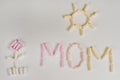 Mothers Day. gift to the child mom, drawing an applique from marshmallow Royalty Free Stock Photo