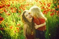 Mothers day, girl and little boy in field of poppy Royalty Free Stock Photo