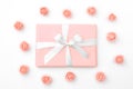 Mothers day greeting card with coral or pink flowers and gift box isolated on white background. 8 March. Top view. Flat lay Royalty Free Stock Photo