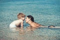 Mothers day holiday of little boy in hands of woman parent. mother with son swim in water. Happy family on Caribbean sea