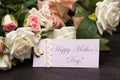 Mothers day lilac card with rustic roses on wooden board Royalty Free Stock Photo