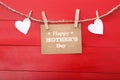 Mothers day message with felt hearts hanging with clothespins Royalty Free Stock Photo