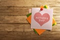 Mothers Day message written on stack of colorful paper note Royalty Free Stock Photo