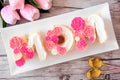 Mothers Day MOM cake with pink and white candy flowers Royalty Free Stock Photo