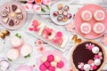 Mothers Day table scene with an assortment of desserts and sweets, overhead on white wood Royalty Free Stock Photo