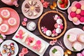 Mothers Day table scene with assorted desserts and sweets, top view on dark wood Royalty Free Stock Photo
